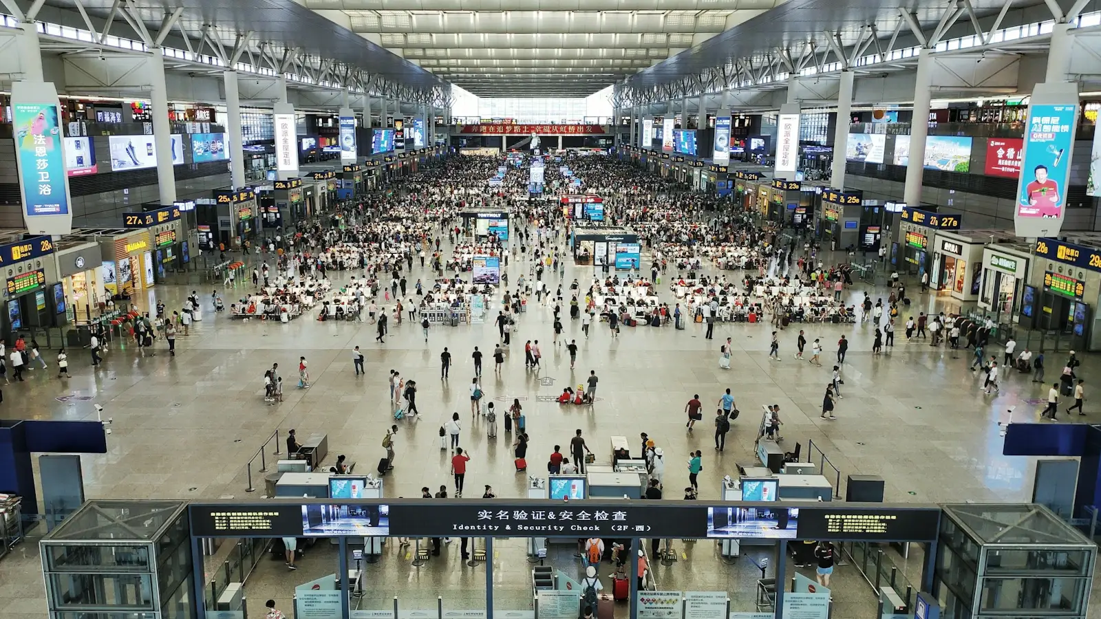 International arrivals hall at a major Chinese airport with passport control signage